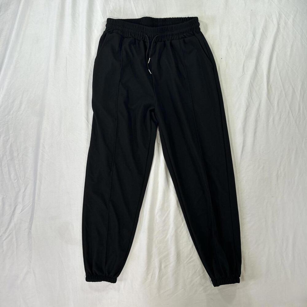 Clean and versatile black polyester joggers.